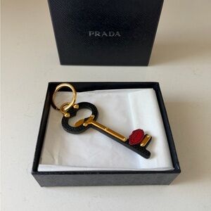 Prada Black and Gold Key Charm with Red Detail